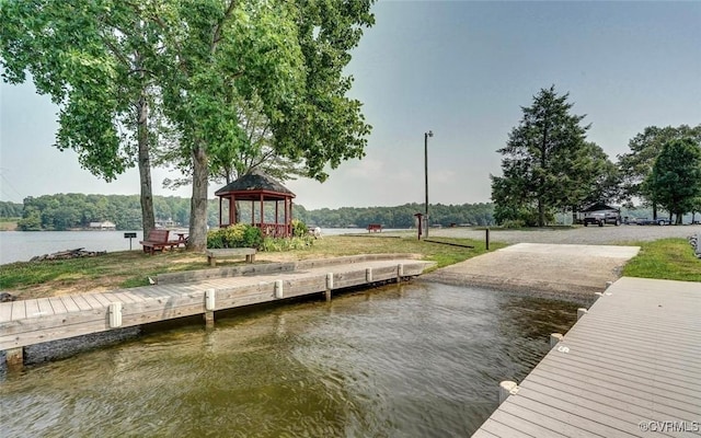 view of dock featuring a water view and a gazebo