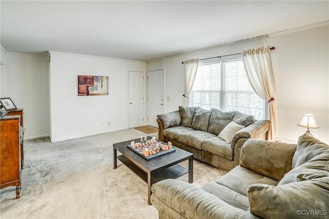 living room featuring baseboards, crown molding, and light colored carpet