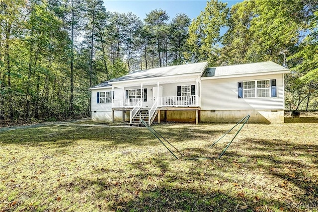 view of front of home with crawl space, stairs, a porch, and a front lawn