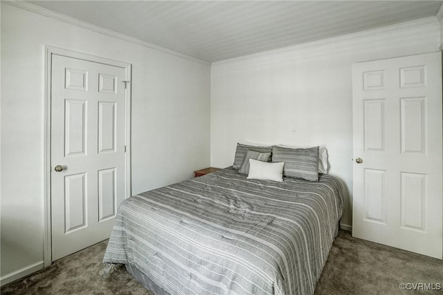 bedroom with crown molding and carpet flooring