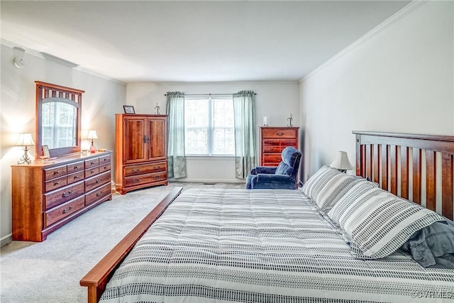 bedroom with ornamental molding, light colored carpet, and baseboards