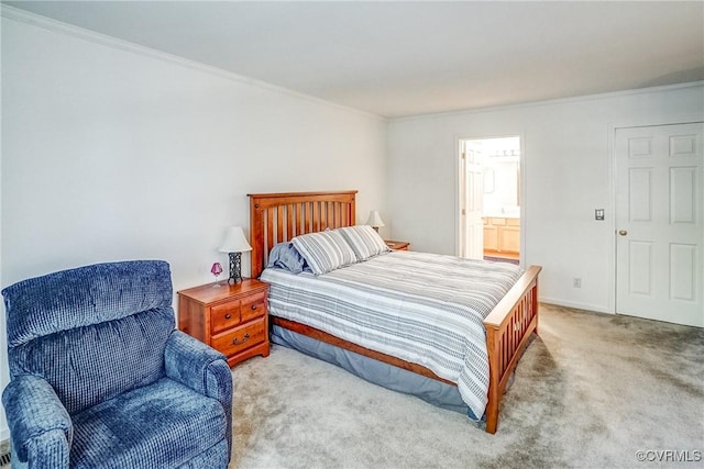 bedroom with baseboards, ornamental molding, connected bathroom, and light colored carpet