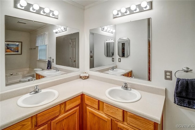 full bath with a bath, double vanity, visible vents, and a sink