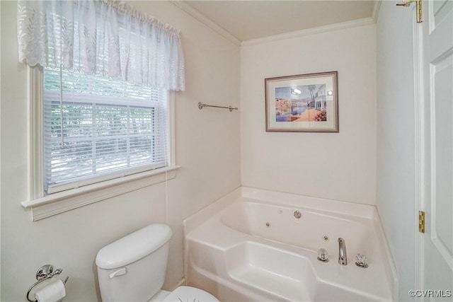 bathroom featuring toilet, crown molding, and a whirlpool tub