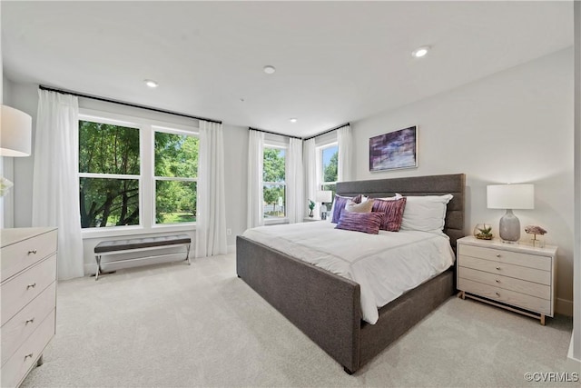 bedroom featuring recessed lighting and light colored carpet