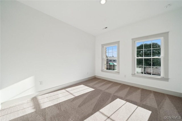 empty room with carpet flooring and baseboards