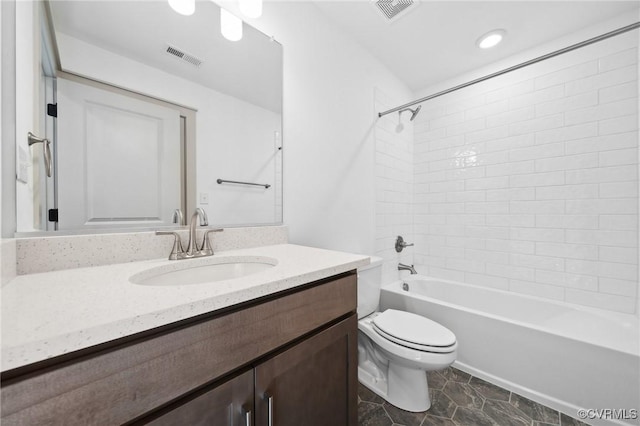 bathroom with toilet, visible vents, shower / washtub combination, and vanity