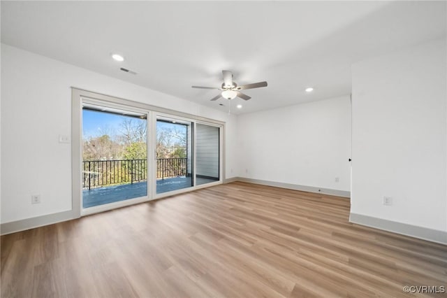 spare room with light wood finished floors, visible vents, baseboards, a ceiling fan, and recessed lighting