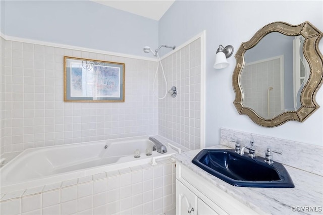 full bath featuring tiled shower / bath combo and vanity