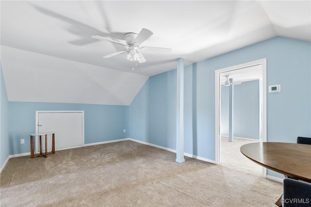 bonus room featuring lofted ceiling, ceiling fan, baseboards, and carpet flooring