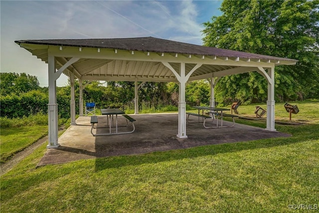 surrounding community featuring a patio, a lawn, and a gazebo