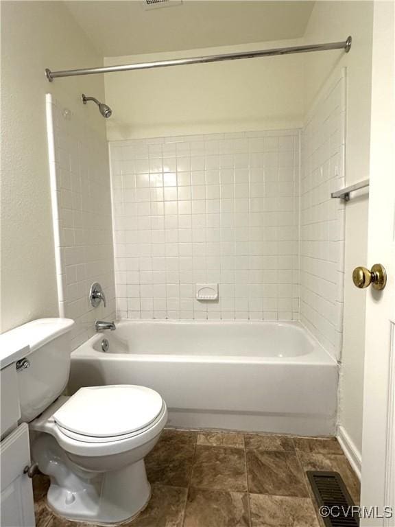 bathroom with bathtub / shower combination, visible vents, and toilet