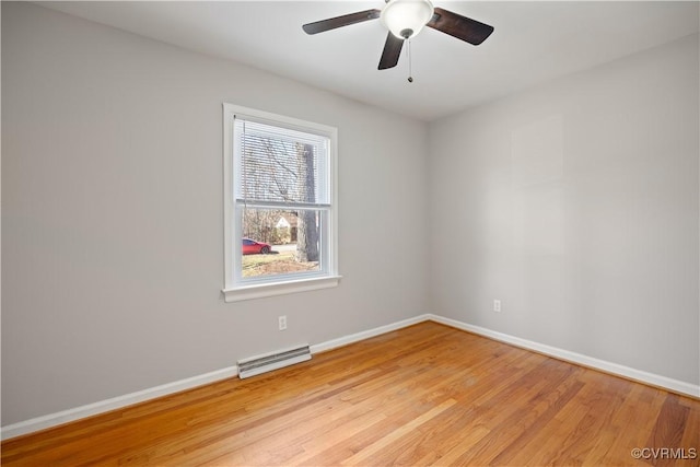 unfurnished room featuring baseboards, ceiling fan, visible vents, and light wood-style floors