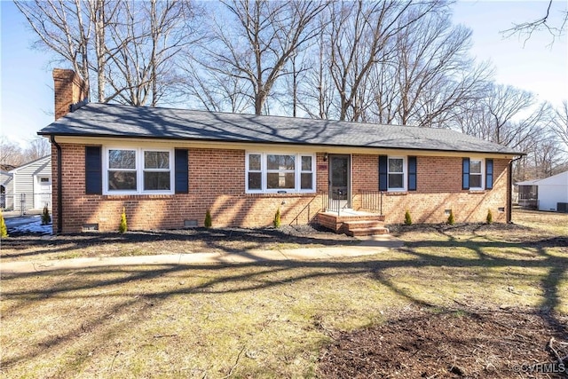 ranch-style home with a front yard, crawl space, brick siding, and a chimney