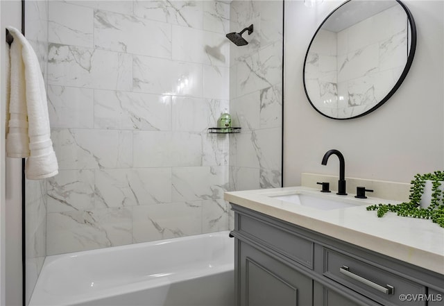 bathroom featuring vanity and shower / tub combination