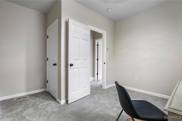 home office with carpet, visible vents, and baseboards