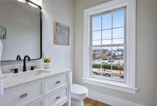 half bath with vanity and toilet