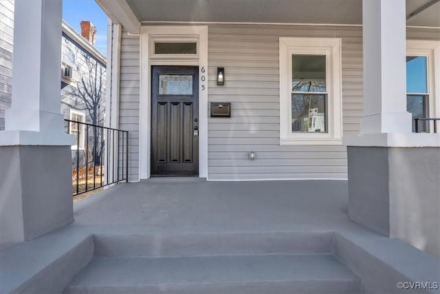 entrance to property featuring covered porch