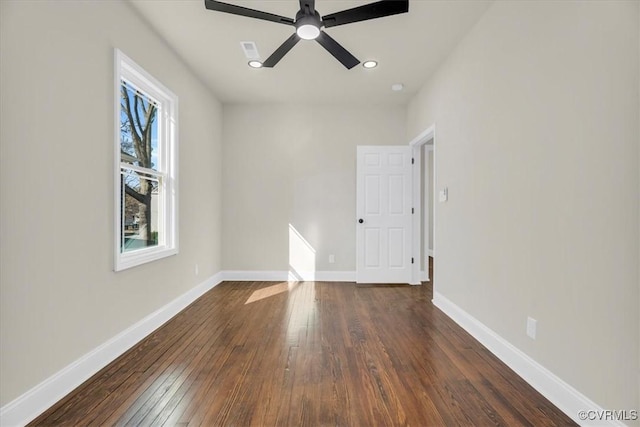 empty room with ceiling fan, recessed lighting, dark wood-style flooring, visible vents, and baseboards