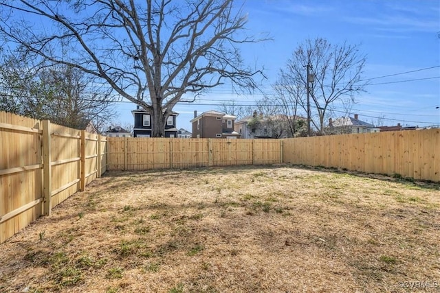 view of yard featuring a fenced backyard