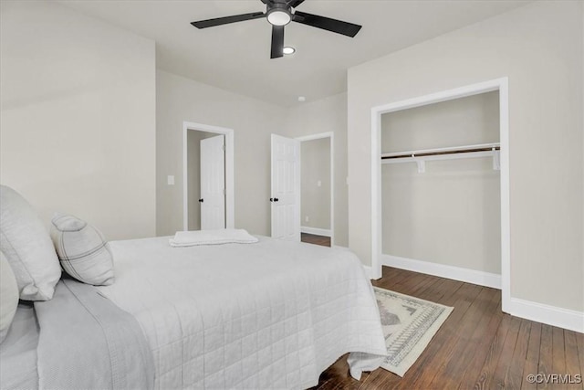 bedroom with a ceiling fan, a closet, baseboards, and hardwood / wood-style flooring