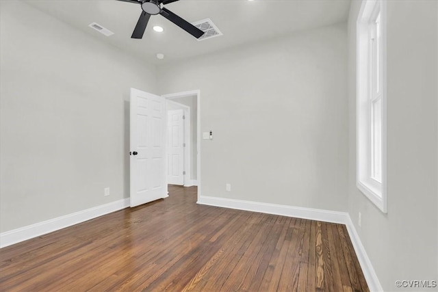 empty room with baseboards, visible vents, dark wood finished floors, ceiling fan, and recessed lighting