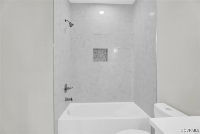 bathroom featuring shower / bathing tub combination, vanity, and toilet