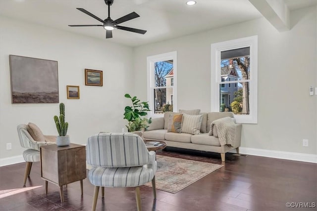 sitting room with recessed lighting, wood finished floors, a ceiling fan, baseboards, and beam ceiling