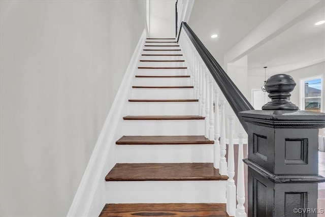 staircase featuring recessed lighting