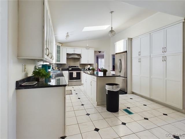 kitchen with dark countertops, a center island, stainless steel appliances, under cabinet range hood, and white cabinetry