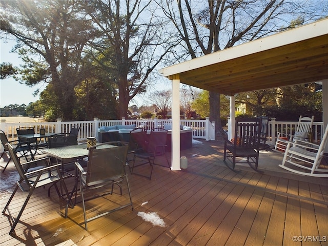 deck with outdoor dining area