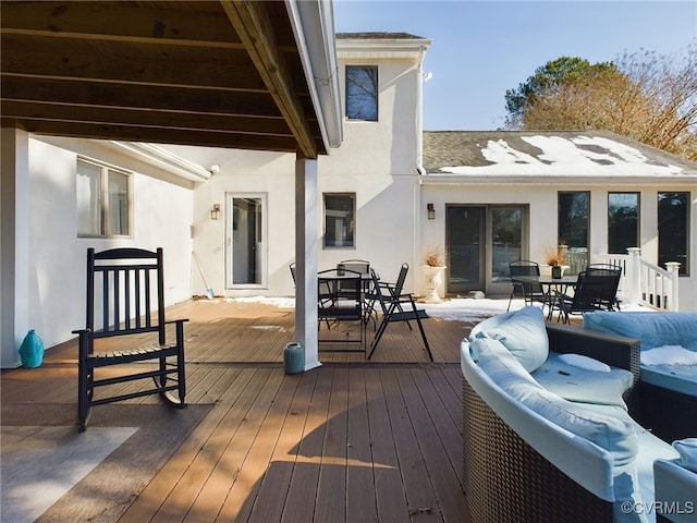 deck with outdoor dining area