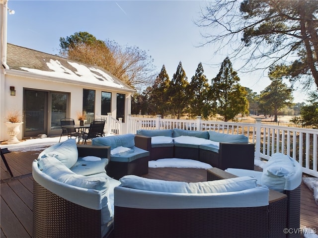 wooden deck with an outdoor hangout area and outdoor dining space