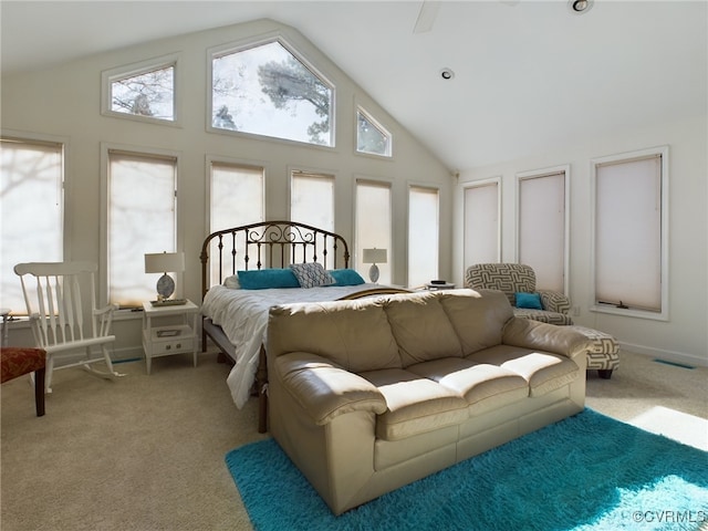 bedroom with carpet floors, visible vents, and high vaulted ceiling