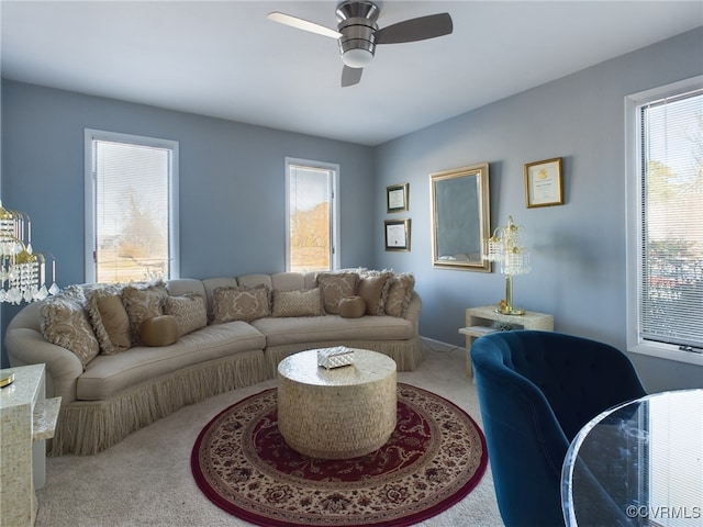 living room featuring a ceiling fan and carpet flooring