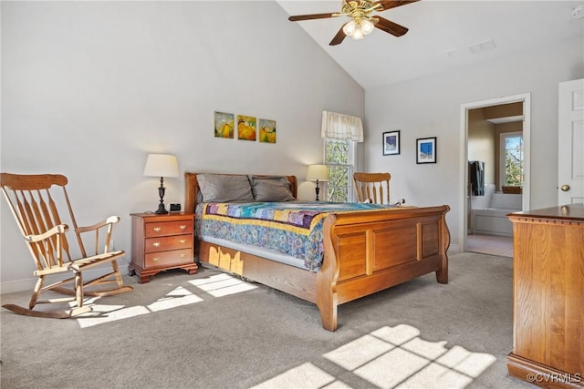 carpeted bedroom featuring multiple windows and high vaulted ceiling