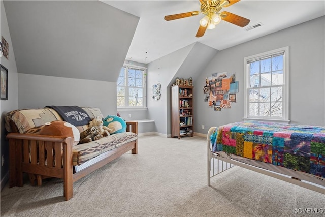 bedroom featuring lofted ceiling, carpet, visible vents, and baseboards