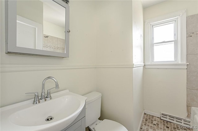 bathroom featuring toilet and vanity