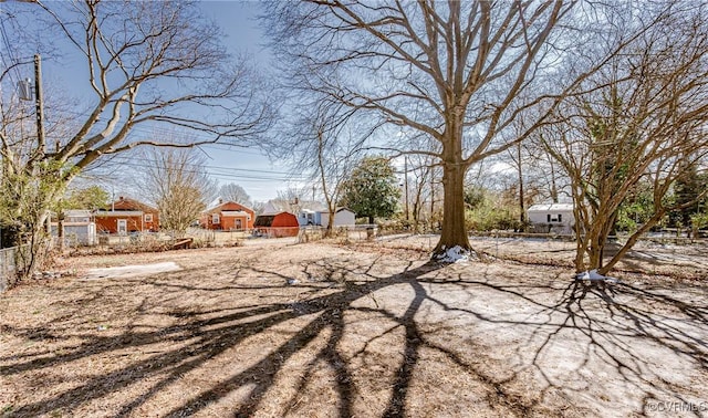 view of yard featuring a residential view and fence