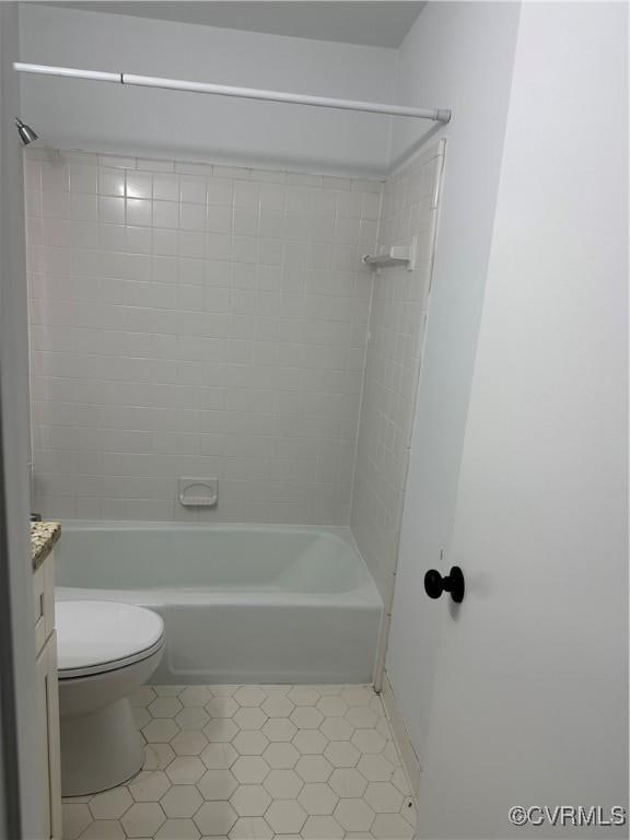 bathroom with toilet, bathtub / shower combination, and vanity