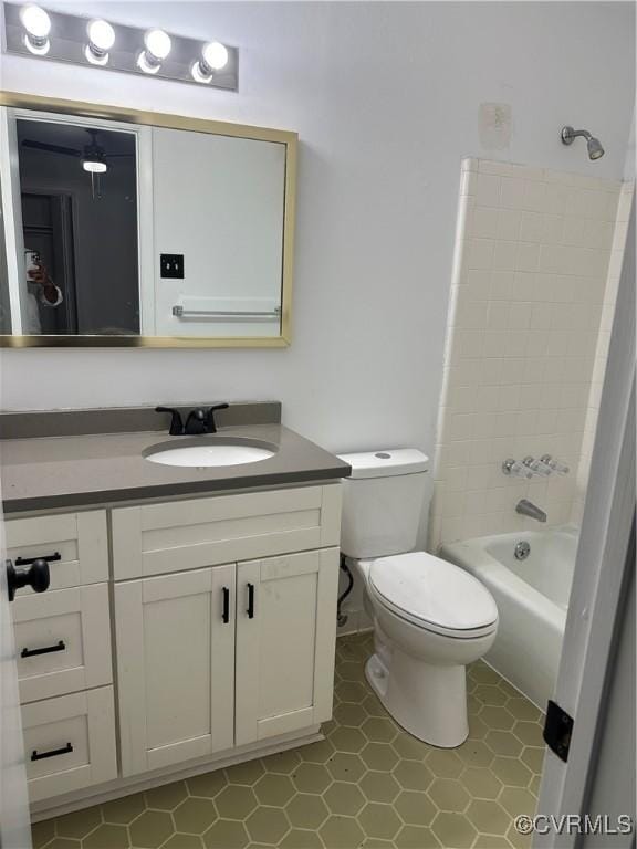 bathroom with vanity, toilet, and shower / bathtub combination