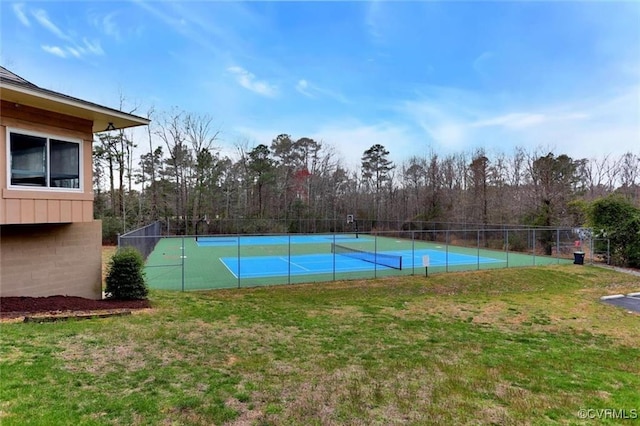 view of pool featuring a tennis court, a lawn, and fence