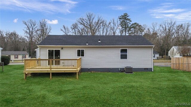 back of property featuring a wooden deck, central AC unit, crawl space, fence, and a yard