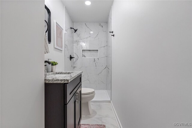 full bath featuring toilet, vanity, baseboards, marble finish floor, and a marble finish shower