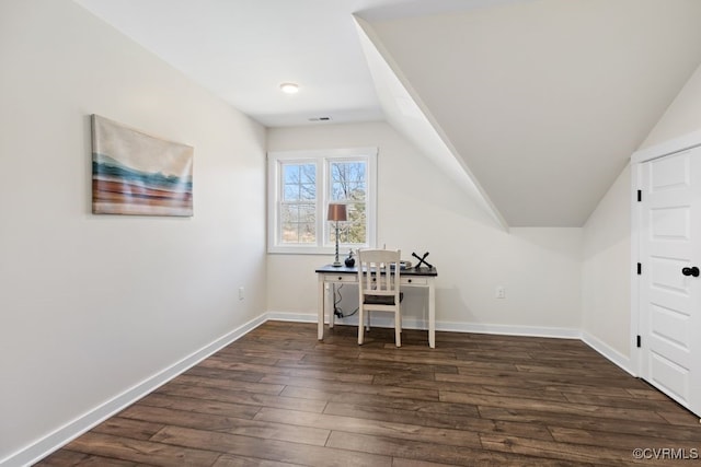 office with lofted ceiling, dark wood-style flooring, and baseboards