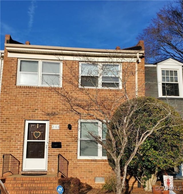 multi unit property with brick siding and crawl space