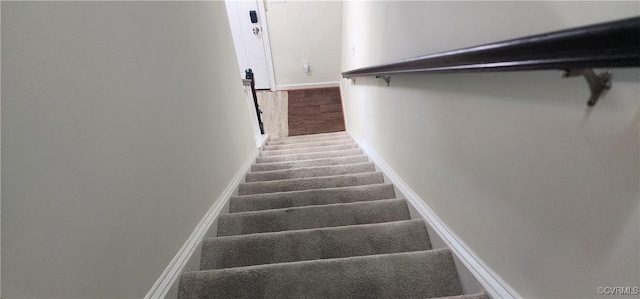 stairs with baseboards