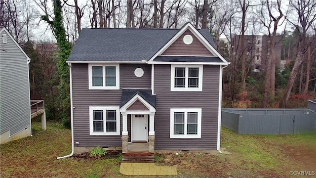 view of front of house featuring crawl space, a front lawn, and roof with shingles