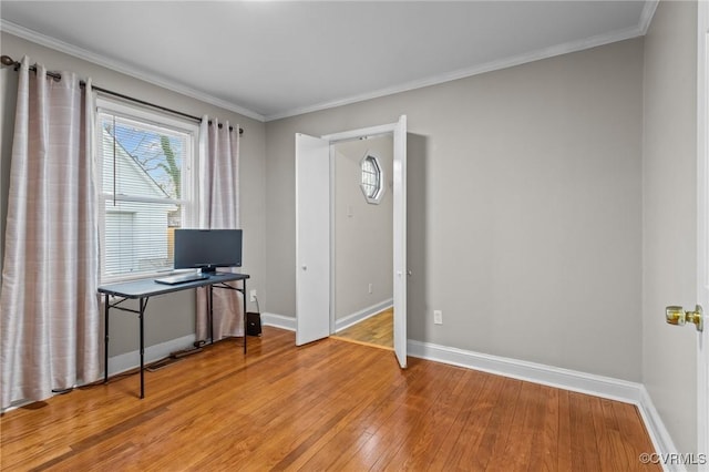 office featuring ornamental molding, light wood-type flooring, and baseboards