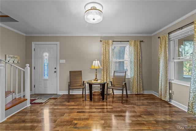 entryway with baseboards, crown molding, stairway, and wood finished floors